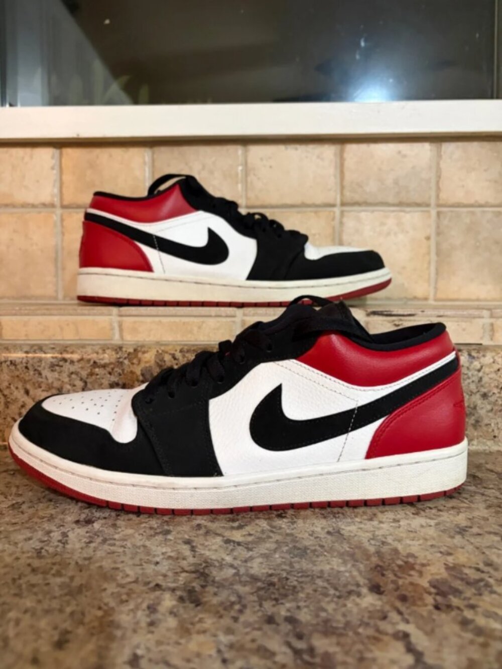 Jordan 1 low black toe